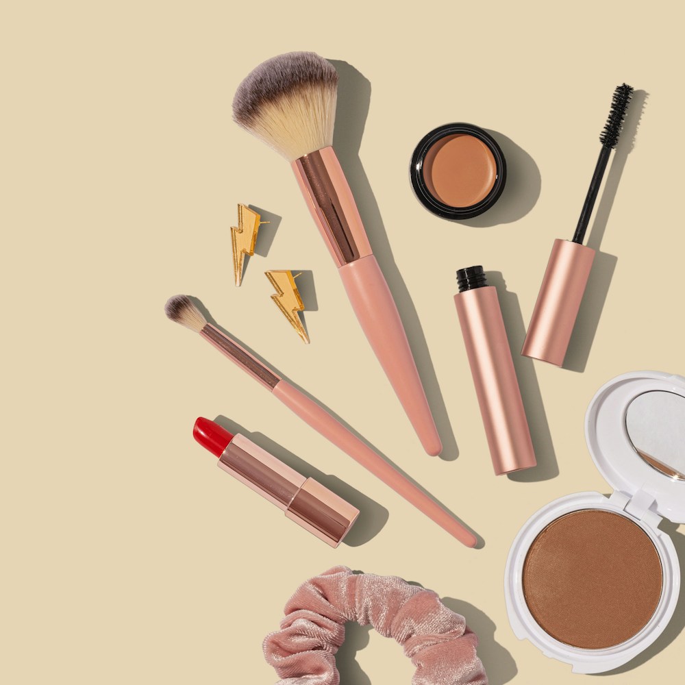 An assortment of makeup tools and cosmetics