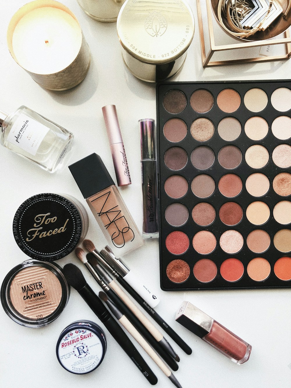 Beauty products arranged for a makeup routine